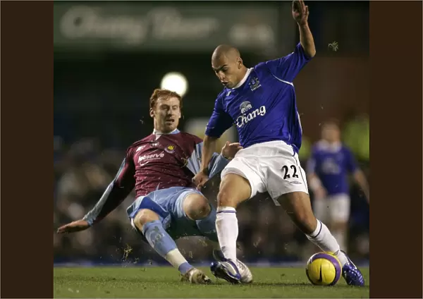 Evertons Vaughan challenges West Ham Uniteds Collins for the ball during their English Premier Lea