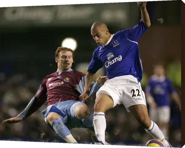 Evertons Vaughan challenges West Ham Uniteds Collins for the ball during their English Premier Lea