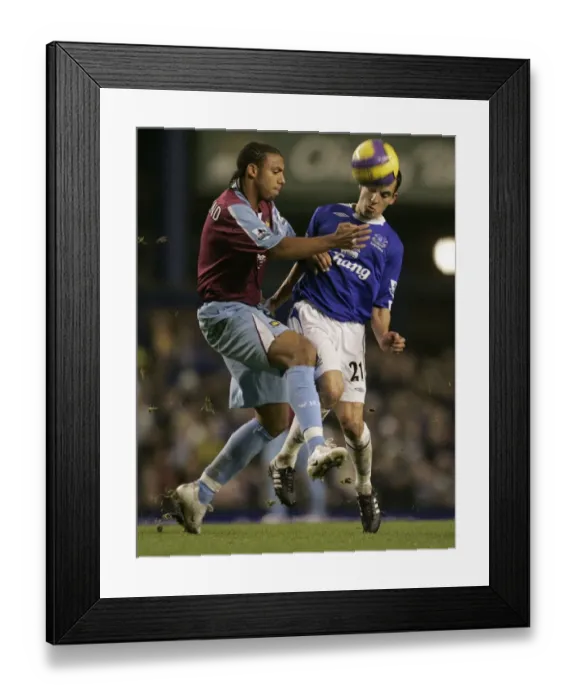 Framed Print : Intense Rivalry: Osman vs. Ferdinand Battle for the Ball - Everton vs. West Ham United