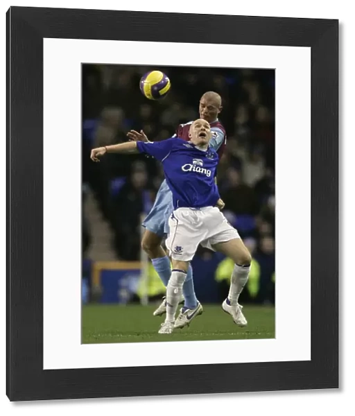 Evertons Johnson challenges West Ham Uniteds Konchesky for the ball during their English Premier L