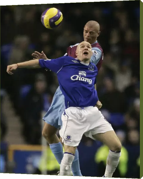 Evertons Johnson challenges West Ham Uniteds Konchesky for the ball during their English Premier L