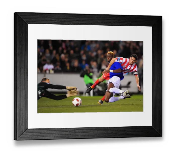 Framed Print : Everton's Louis Saha vs Melbourne Heart's Simon Colosimo: Intense Clash during Pre-Season Friendly at Etihad Stadium