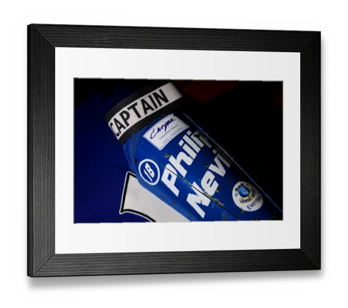 Framed Print : Everton's Phil Neville: Gearing Up for Pre-Season with Shinpads and Captain's Armband at Melbourne Heart's Etihad Stadium