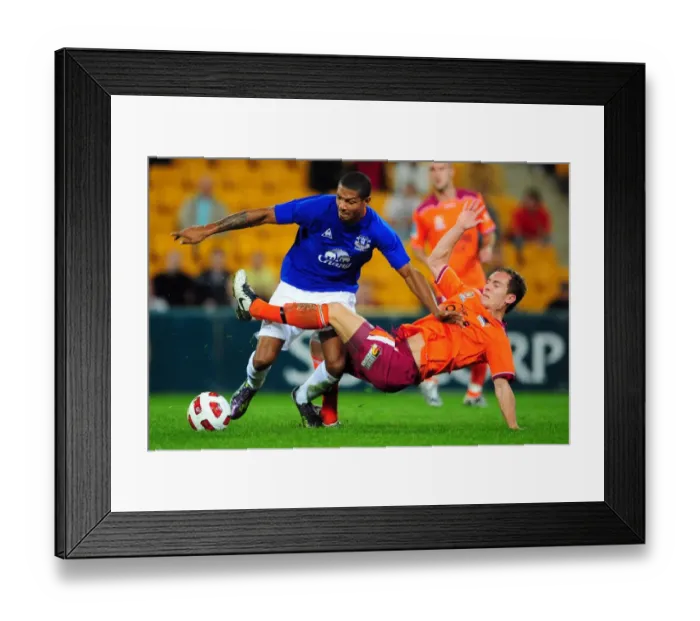 Framed Print : Intense Rivalry: Jermaine Beckford vs Matt Smith Battle for Ball at Suncorp Stadium - Everton vs Brisbane Roar