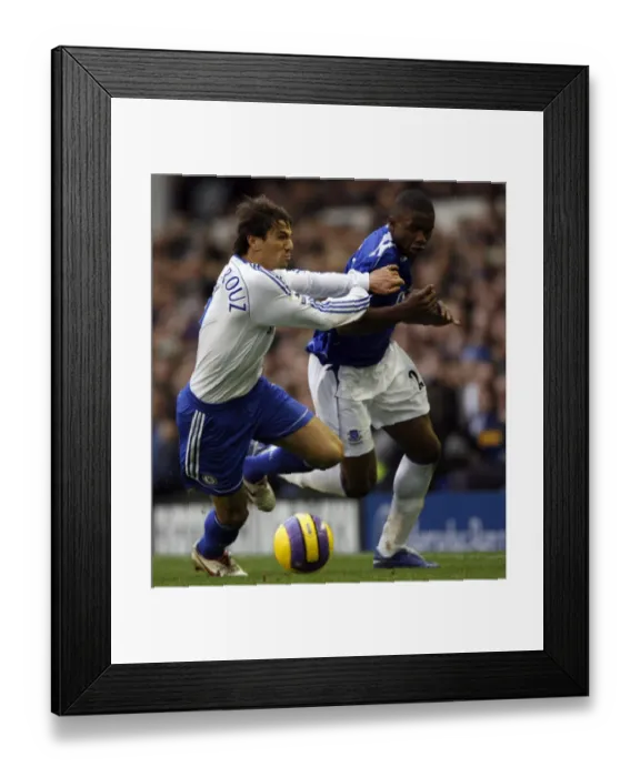 Framed Print : Evertons Anichebe is held back by Chelseas Boulahrouz during their English Premier League soccer m Framed Print : Evertons Anichebe is held back by Chelseas Boulahrouz during their English Premier League soccer m