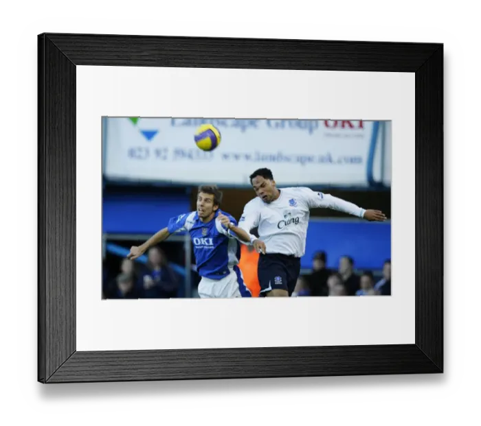 Framed Print : Portsmouth v Everton Gary O Neil in action against Evertons Joleon Lescott Framed Print : Portsmouth v Everton Gary O Neil in action against Evertons Joleon Lescott