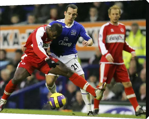 Everton v Middlesbrough George Boateng battles with Leon Osman