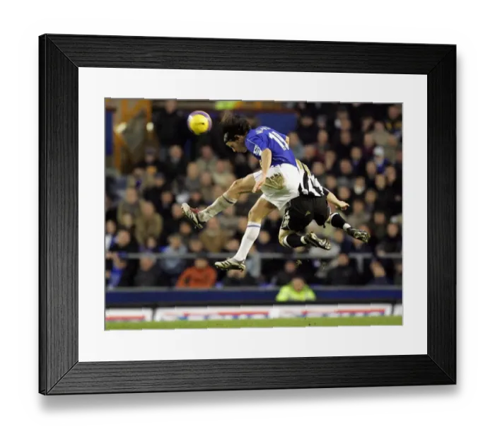 Framed Print : Everton v Newcastle United Nuno Valente wins a header from Newcastles James Milner Framed Print : Everton v Newcastle United Nuno Valente wins a header from Newcastles James Milner