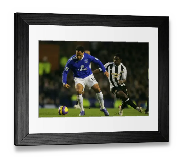 Framed Print : Everton v Newcastle United Joleon Lescott and Obafemi Martins in action Framed Print : Everton v Newcastle United Joleon Lescott and Obafemi Martins in action