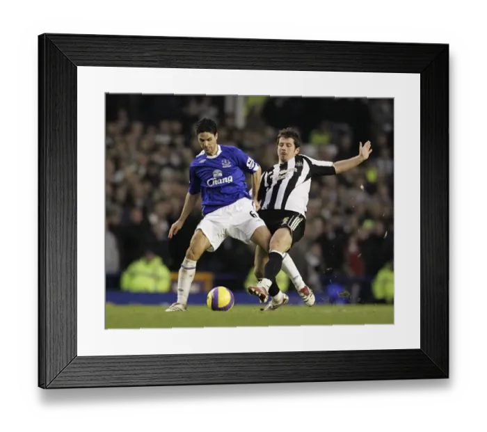 Framed Print : Everton v Newcastle United - Mikel Arteta and Emre in action