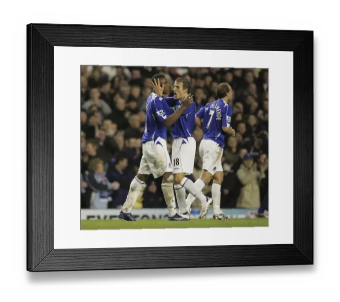 Framed Print : Everton v Newcastle United Victor Anichebe celebrates after scoring his second goal with captain Phil Framed Print : Everton v Newcastle United Victor Anichebe celebrates after scoring his second goal with captain Phil
