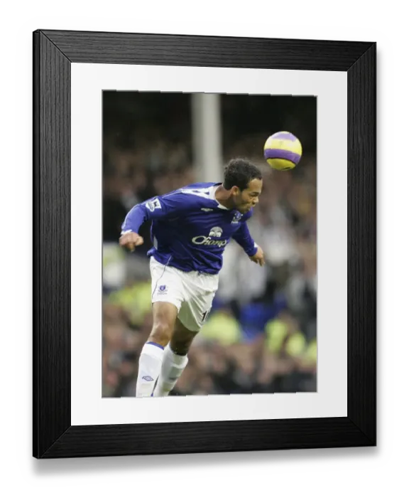 Framed Print : Everton v Newcastle United Evertons Joleon Lescott head the ball Framed Print : Everton v Newcastle United Evertons Joleon Lescott head the ball