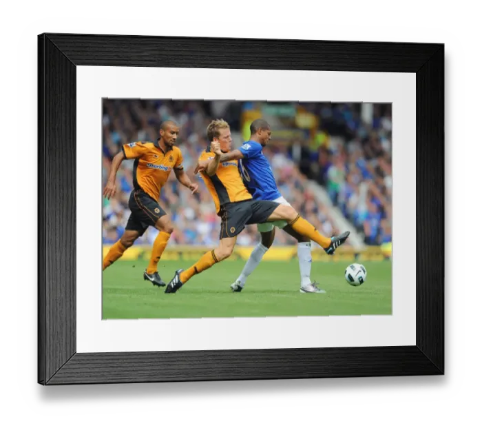 Framed Print : Everton vs. Wolverhampton Wanderers: A Tight Battle at Goodison Park - Jermaine Beckford vs. Christophe Berra: Intense Rivalry on the Field Framed Print : Everton vs. Wolverhampton Wanderers: A Tight Battle at Goodison Park - Jermaine Beckford vs. Christophe Berra: Intense Rivalry on the Field