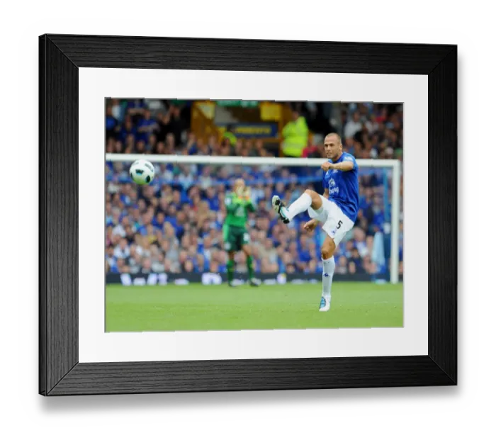 Framed Print : John Heitinga's Intense Performance: Everton vs. Wolverhampton Wanderers, Premier League 2010-11 (Everton at Goodison Park)
