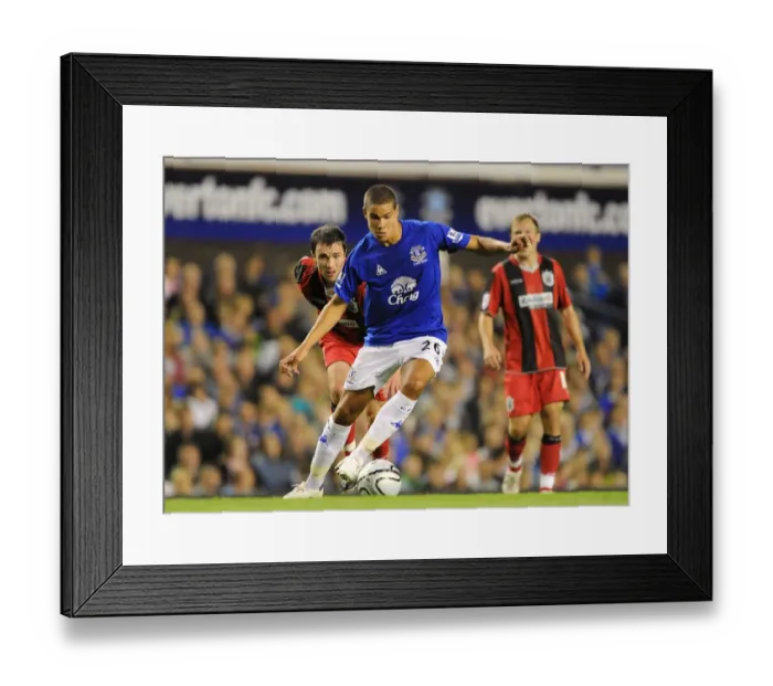 Framed Print : Jack Rodwell vs. Damien Johnson: Everton vs. Huddersfield Town's Intense Carling Cup Showdown at Goodison Park (25 August 2010) Framed Print : Jack Rodwell vs. Damien Johnson: Everton vs. Huddersfield Town's Intense Carling Cup Showdown at Goodison Park (25 August 2010)