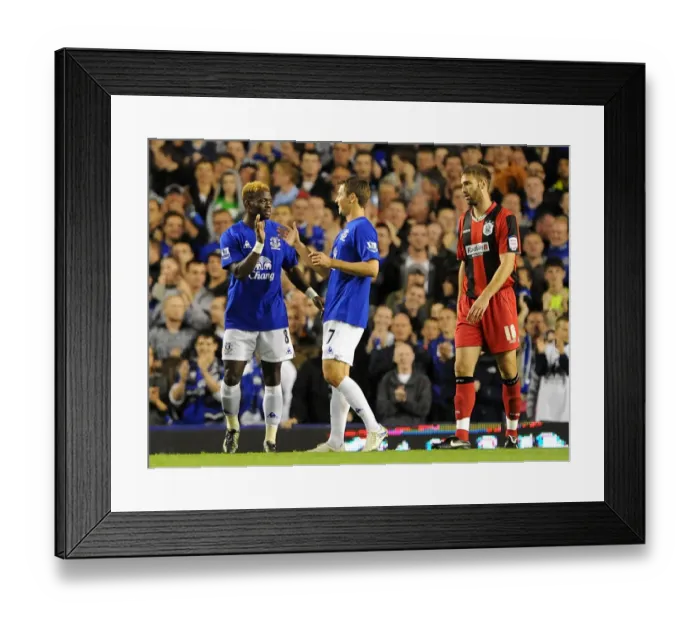Framed Print : Everton's Louis Saha: Four-Goal Blitz Against Huddersfield Town in Carling Cup Framed Print : Everton's Louis Saha: Four-Goal Blitz Against Huddersfield Town in Carling Cup