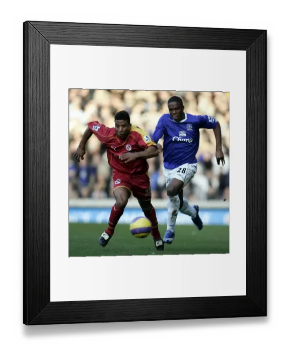 Framed Print : Clash at Goodison Park: Victor Anichebe vs. Ulises De La Cruz (Everton vs. Reading, FA Barclays Premiership, January 14, 2007)