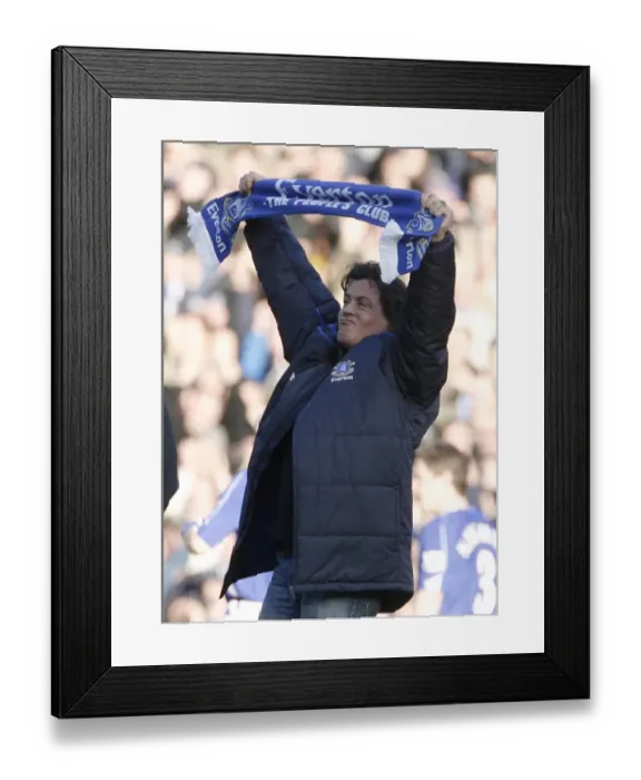 Framed Print : U. S. actor Stallone holds a scarf as he walks on the pitch at the English Premier League match betwe Framed Print : U. S. actor Stallone holds a scarf as he walks on the pitch at the English Premier League match betwe