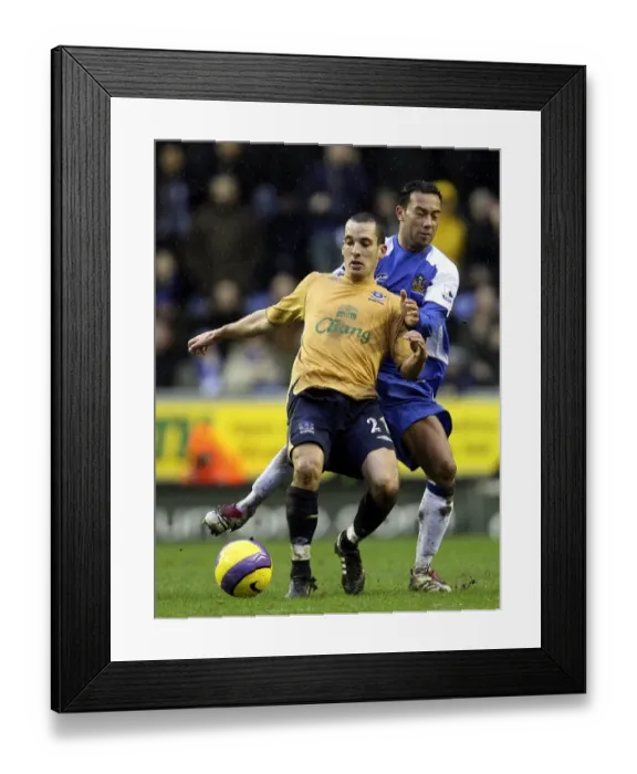 Framed Print : Denny Landzaat vs. Leon Osman: A Football Rivalry Ignites at Wigan Athletic's JJB Stadium (Wigan v Everton, 21st January 2007)