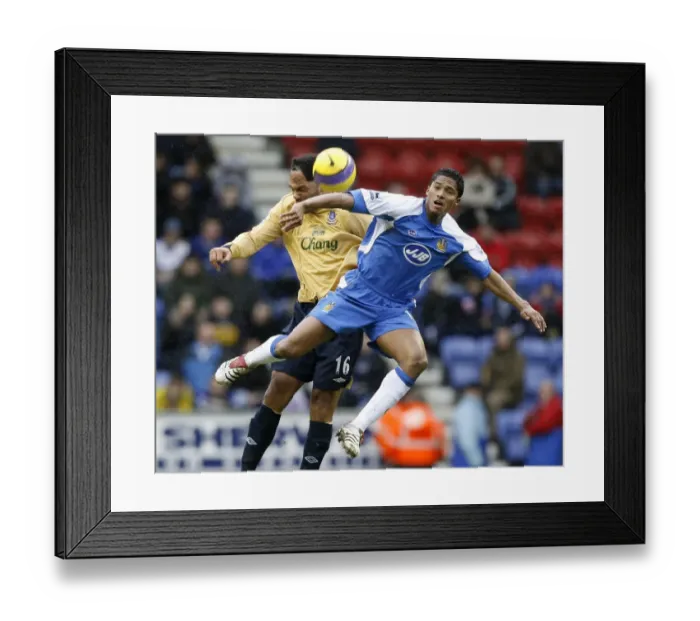 Framed Print : Wigan Athletics Valencia challenges Evertons Lescott for the ball during their English Premier Lea Framed Print : Wigan Athletics Valencia challenges Evertons Lescott for the ball during their English Premier Lea