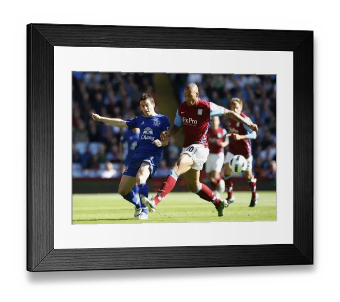 Framed Print : Intense Battle: Leighton Baines vs. John Carew - Everton vs. Aston Villa, Premier League (2010) Framed Print : Intense Battle: Leighton Baines vs. John Carew - Everton vs. Aston Villa, Premier League (2010)