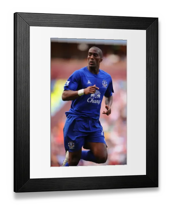 Framed Print : Sylvain Distin vs. Aston Villa: Everton's Defender Stands Firm in Barclays Premier League Clash (29 August 2010)
