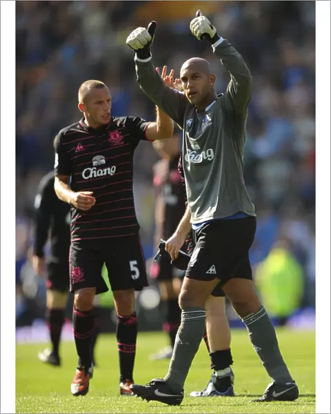 Everton's Heitinga and Howard: Victory Celebration at Fratton Park after Portsmouth Match