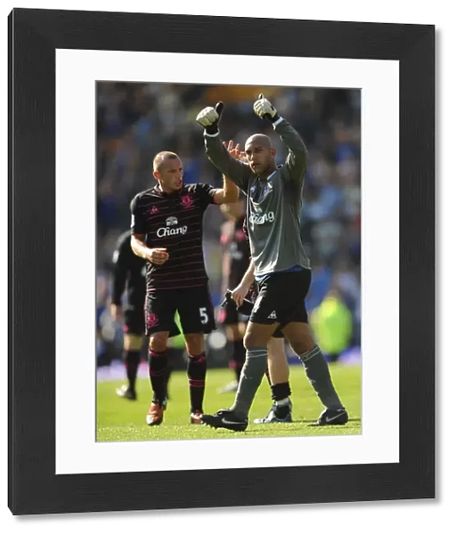 Everton's Heitinga and Howard: Victory Celebration at Fratton Park after Portsmouth Match
