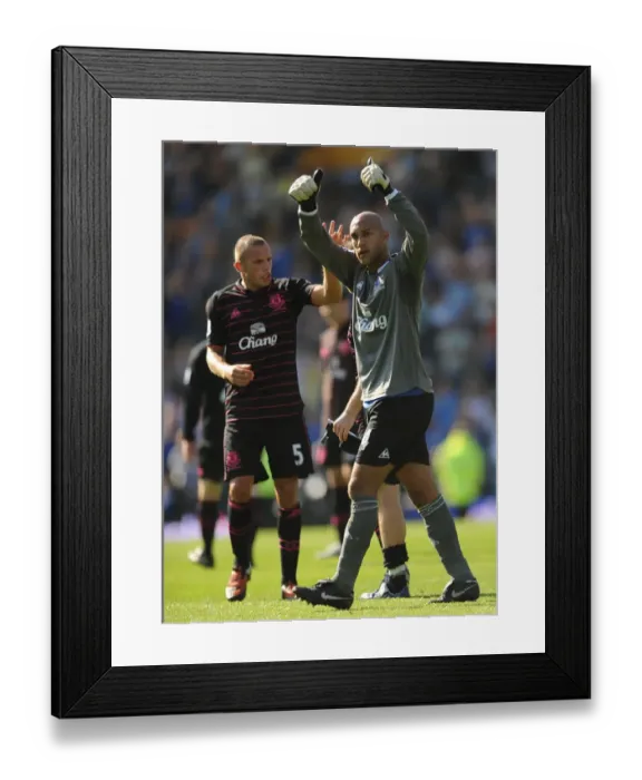 Framed Print : Everton's Heitinga and Howard: Victory Celebration at Fratton Park after Portsmouth Match Framed Print : Everton's Heitinga and Howard: Victory Celebration at Fratton Park after Portsmouth Match