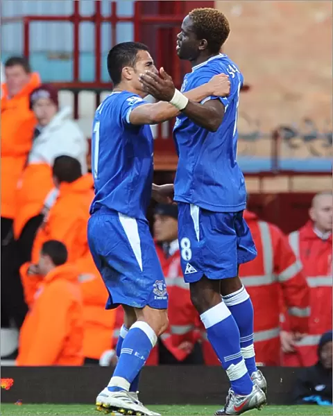 Everton's Saha and Cahill: A Powerful Duo Celebrates the Opening Goal Against West Ham in the Premier League