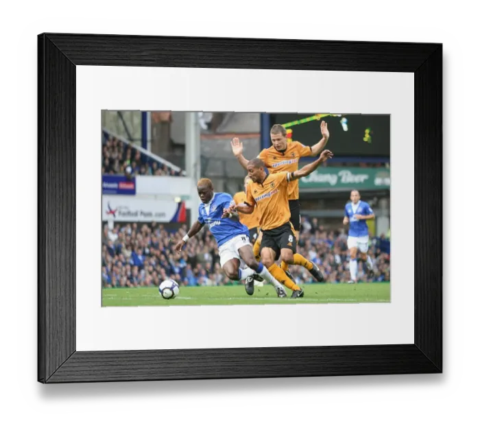 Framed Print : Saha's Tight Tussle: Everton vs. Wolverhampton Wanderers - A Battle of Will at Goodison Park Framed Print : Saha's Tight Tussle: Everton vs. Wolverhampton Wanderers - A Battle of Will at Goodison Park