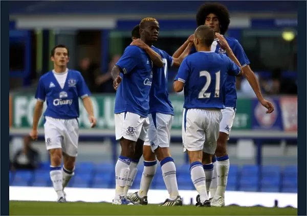 Everton's Unforgettable Goal: Saha's Opener Celebrated by Cahill, Fellaini, and Osman