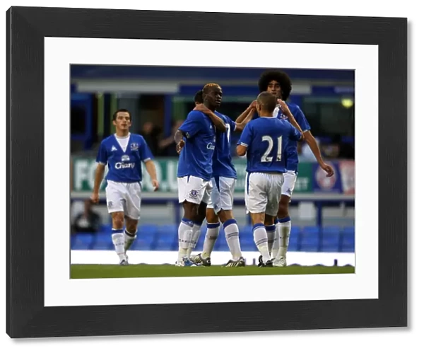 Everton's Unforgettable Goal: Saha's Opener Celebrated by Cahill, Fellaini, and Osman