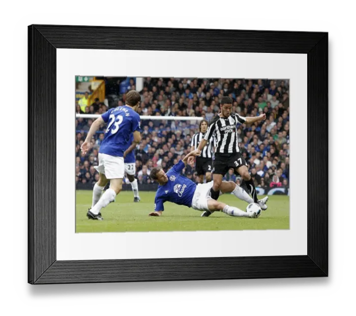 Framed Print : Jagielka vs Ben Arfa: A Battle for the Ball - Everton vs Newcastle United (Barclays Premier League, September 18, 2010)