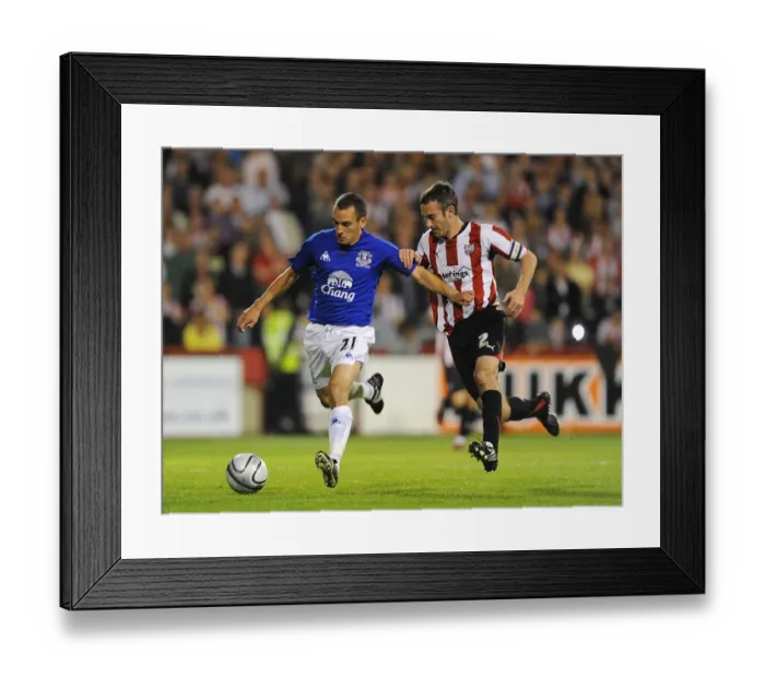 Framed Print : Osman vs. O'Connor: A Football Rivalry Ignites in Everton's Carling Cup Showdown at Griffin Park Framed Print : Osman vs. O'Connor: A Football Rivalry Ignites in Everton's Carling Cup Showdown at Griffin Park
