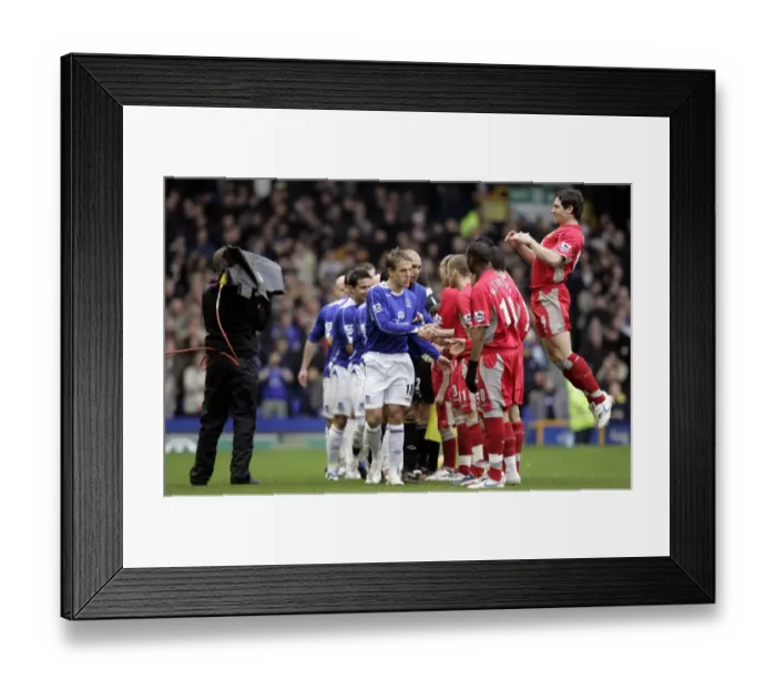 Framed Print : Everton v Blackburn Rovers Phil Neville leads his team as they shake hands with the Blackburn players