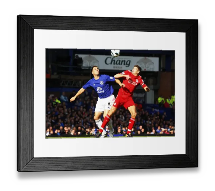 Framed Print : Intense Rivalry: Jagielka vs. Gerrard - The Battle for the Ball at Goodison Park (Everton vs. Liverpool, Barclays Premier League, October 2010) Framed Print : Intense Rivalry: Jagielka vs. Gerrard - The Battle for the Ball at Goodison Park (Everton vs. Liverpool, Barclays Premier League, October 2010)