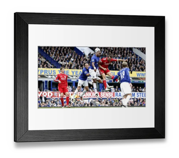 Framed Print : Intense Rivalry: Distin vs. Kyrgiakos Aerial Battle in the Everton vs. Liverpool Premier League Clash (October 2010) Framed Print : Intense Rivalry: Distin vs. Kyrgiakos Aerial Battle in the Everton vs. Liverpool Premier League Clash (October 2010)