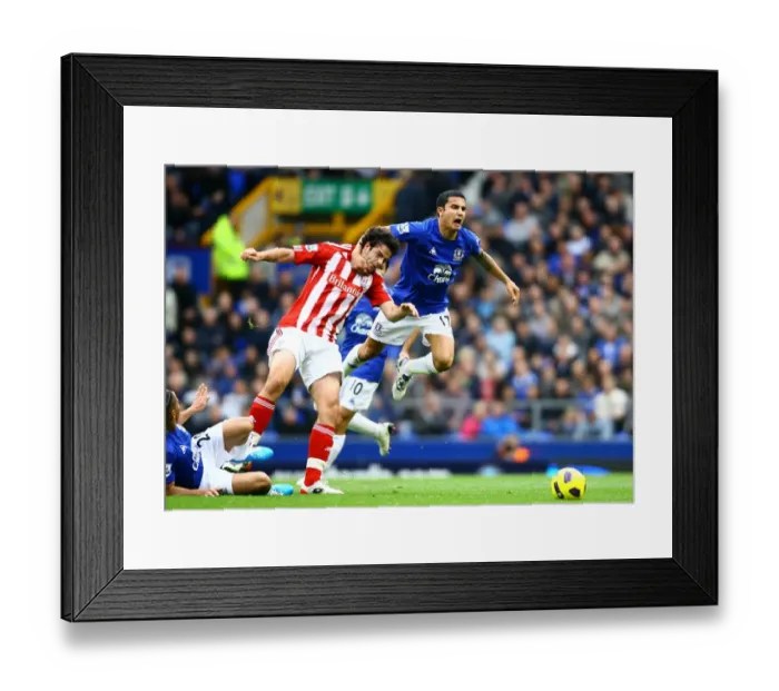 Framed Print : Intense Rivalry: Tim Cahill vs. Marc Wilson - Everton vs. Stoke City's Fierce Battle for Possession Framed Print : Intense Rivalry: Tim Cahill vs. Marc Wilson - Everton vs. Stoke City's Fierce Battle for Possession