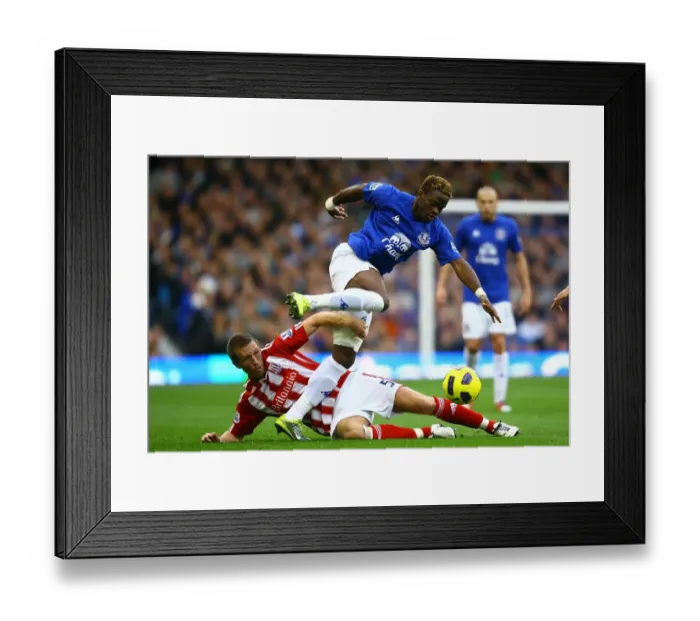 Framed Print : A Battle for the Ball: Louis Saha vs Danny Collins at Goodison Park - Everton vs Stoke City (Barclays Premier League, 30 October 2010)