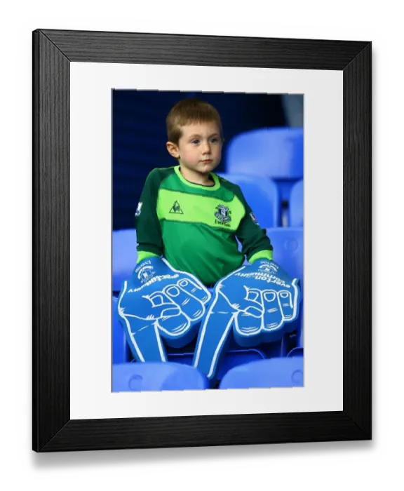 Framed Print : Young Everton Fan's Thrill: Giant Foam Hands at Packed Goodison Park before Everton vs Stoke City (BPL 2010) Framed Print : Young Everton Fan's Thrill: Giant Foam Hands at Packed Goodison Park before Everton vs Stoke City (BPL 2010)