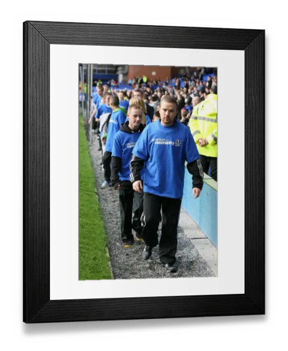 Framed Print : Community Unity at Goodison Park: Everton Volunteers and Staff Join Forces with Stoke City During Barclays Premier League Match (30 October 2010)