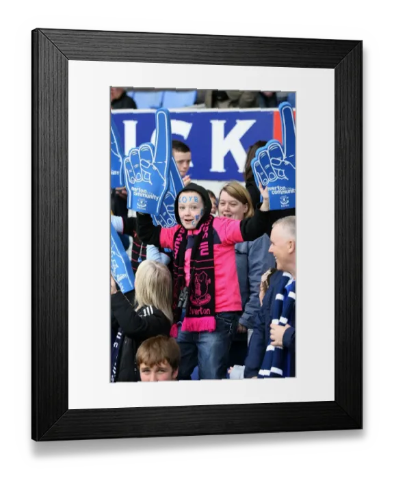 Framed Print : Young Everton Fan's Thrill: Half-Time Excitement at Goodison Park with Giant Foam Hands (Everton vs Stoke City, Barclays Premier League, 2010)