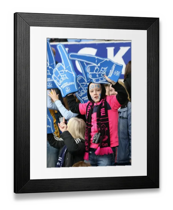 Framed Print : Half-Time Thrills: A Young Everton Fan's Excitement with Giant Foam Hands at Goodison Park Framed Print : Half-Time Thrills: A Young Everton Fan's Excitement with Giant Foam Hands at Goodison Park