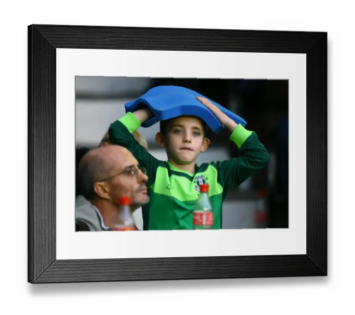Framed Print : Young Everton Fan's Thrill: Giant Foam Hand at Goodison Park during Everton vs Stoke City (Premier League 2010)