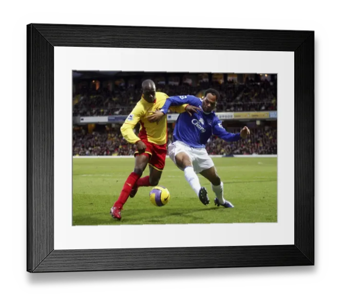 Framed Print : Clash on the Pitch: Steve Kabba vs. Joleon Lescott - A Rivalry Unforgettable: Watford vs. Everton Framed Print : Clash on the Pitch: Steve Kabba vs. Joleon Lescott - A Rivalry Unforgettable: Watford vs. Everton