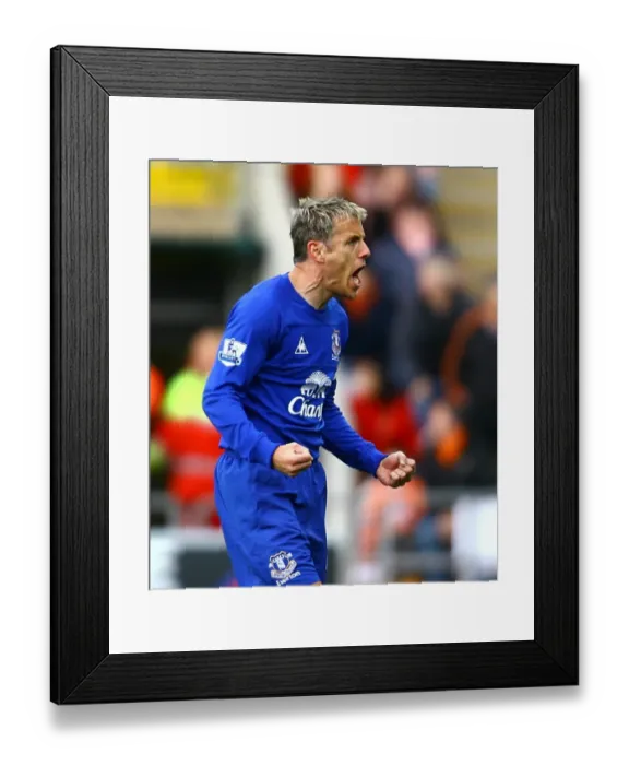 Framed Print : Everton's Unforgettable Moment: Neville and Cahill Celebrate Goal vs. Blackpool
