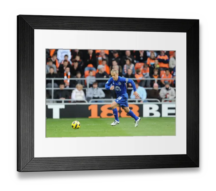 Framed Print : Phil Neville Leads Everton in Barclays Premier League Battle at Bloomfield Road Against Blackpool Framed Print : Phil Neville Leads Everton in Barclays Premier League Battle at Bloomfield Road Against Blackpool