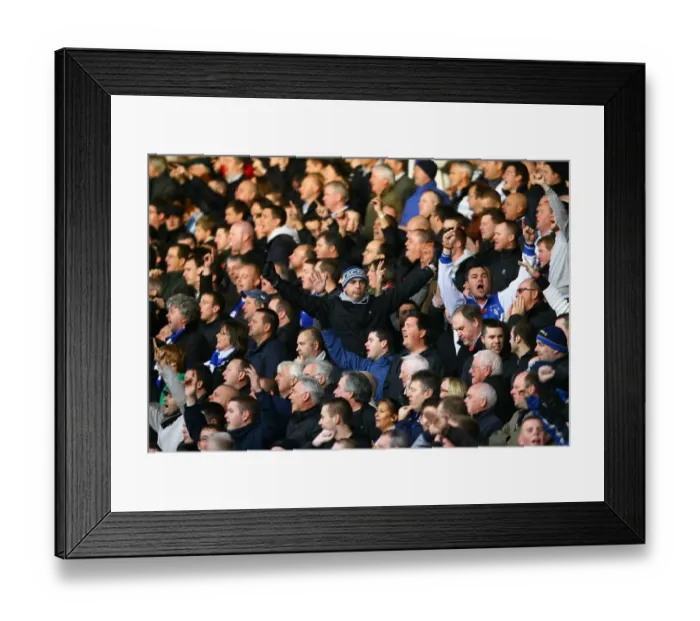 Framed Print : Evertonians Unwavering Passion: Bloomfield Road (2010) - A Sea of Blue Amidst the Blackpool vs Everton Premier League Battle Framed Print : Evertonians Unwavering Passion: Bloomfield Road (2010) - A Sea of Blue Amidst the Blackpool vs Everton Premier League Battle