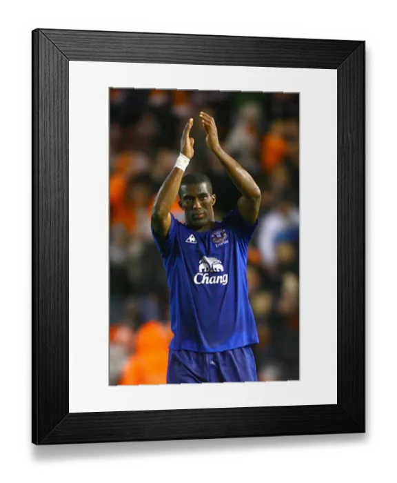 Framed Print : Sylvain Distin vs. Blackpool: Everton's Defender Faces Off in Barclays Premier League Match (November 6, 2010)